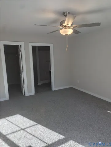 a view of a livingroom with a chandelier fan