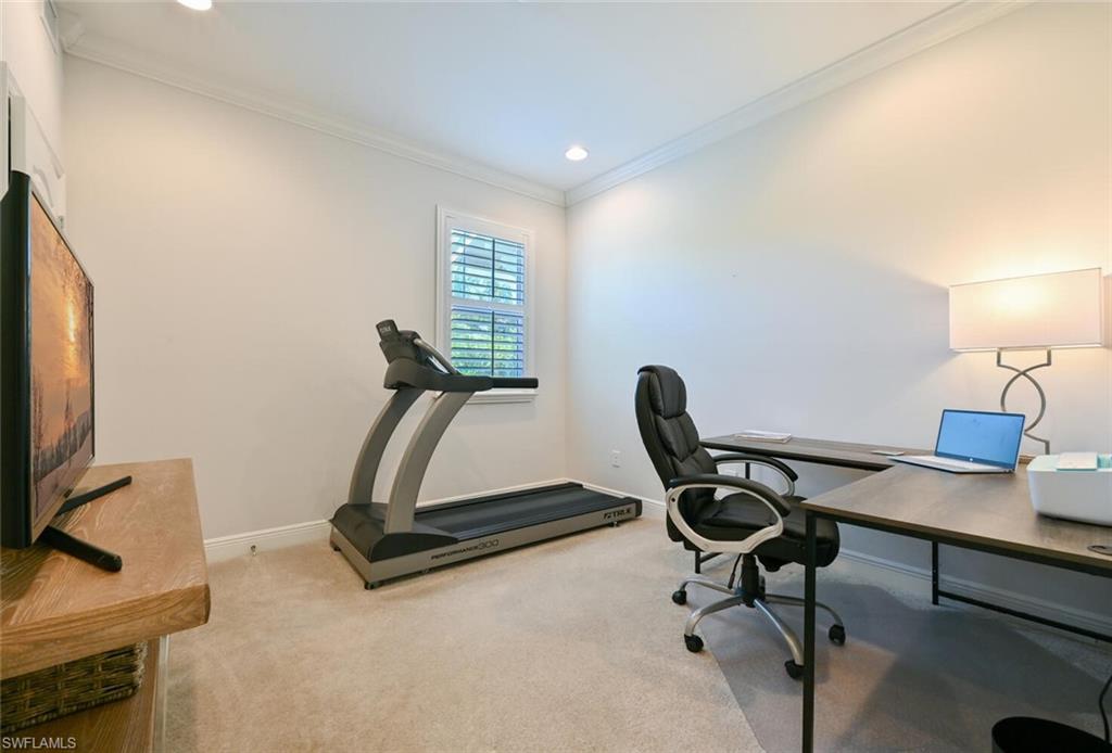 6934 Avalon Circle, Unit 401 Naples, FL 34112 - Photo 7 of 13 a view of a workspace with furniture and a window