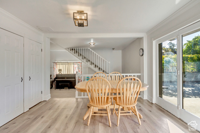 360 East Center Street Centerville, UT 84014 - Photo 13 of 41 Dining space with light wood-type flooring, stairs, and ornamental molding