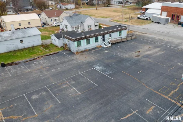 an aerial view of a house with outdoor space