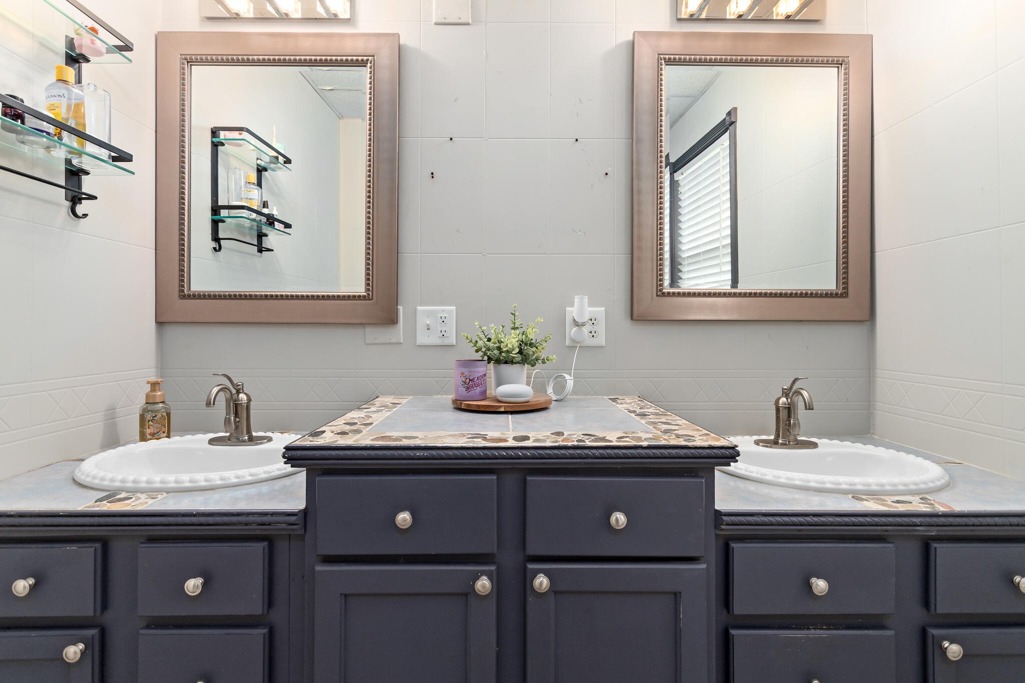 7230 Bythewood Road Beaumont, TX 77713 - Photo 24 of 35 a bathroom with a granite countertop sink and a mirror