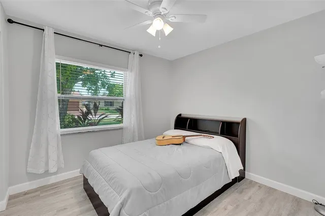 a bedroom with a bed and window