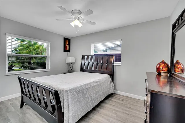 a bedroom with a bed and a table