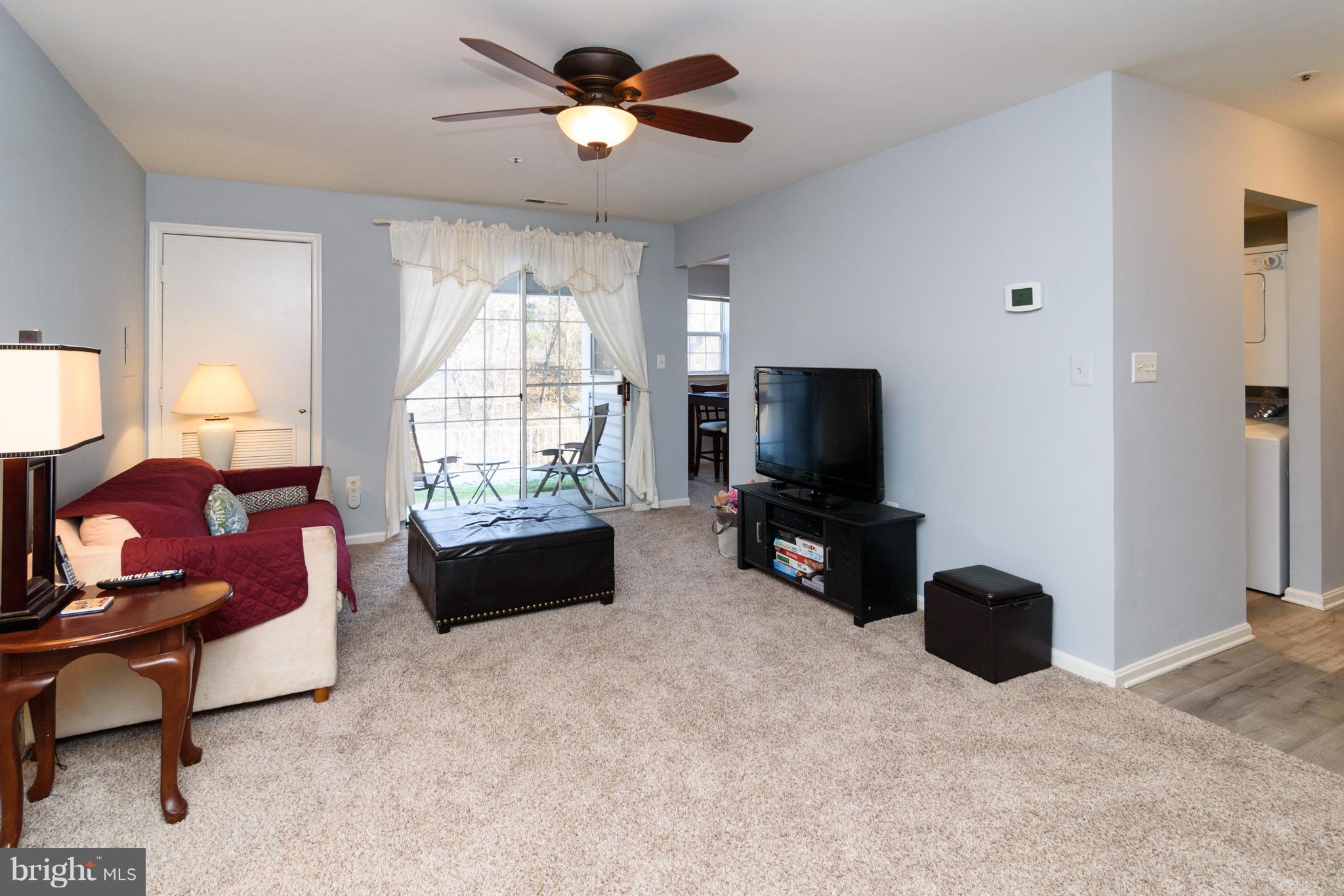 8611 Falls Run Road, Unit B Ellicott City, MD 21043 - Photo 8 of 24 Bright slider to rear patio