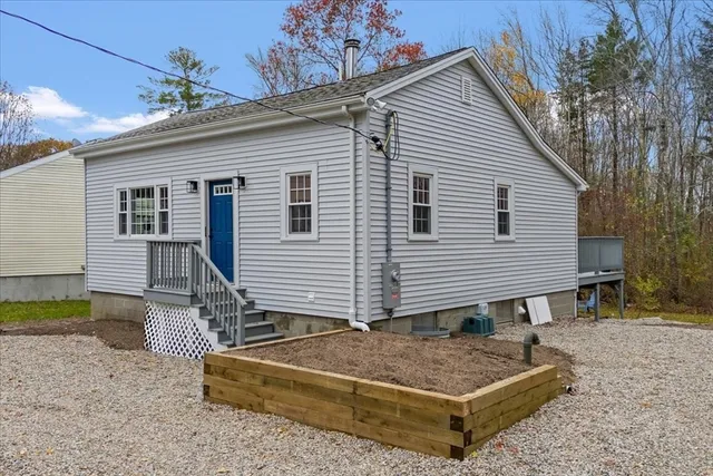a backyard of a house with seating space