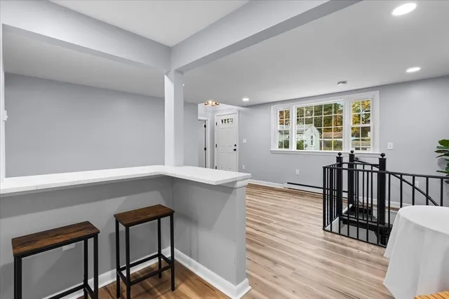 a view of kitchen with sink microwave and refrigerator