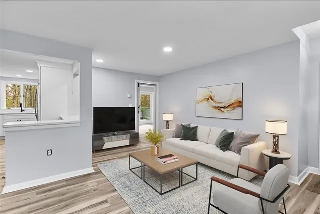 a view of wooden floor and windows in a room