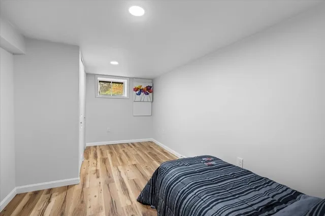 a work room with furniture and a window