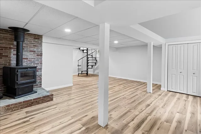 a view of a room with wooden floor