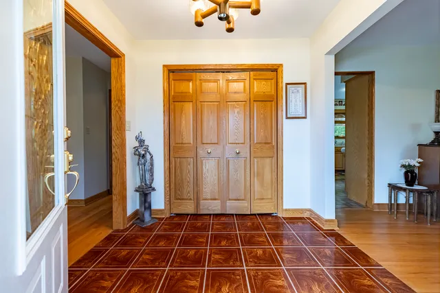 a living room with furniture a rug and a large window
