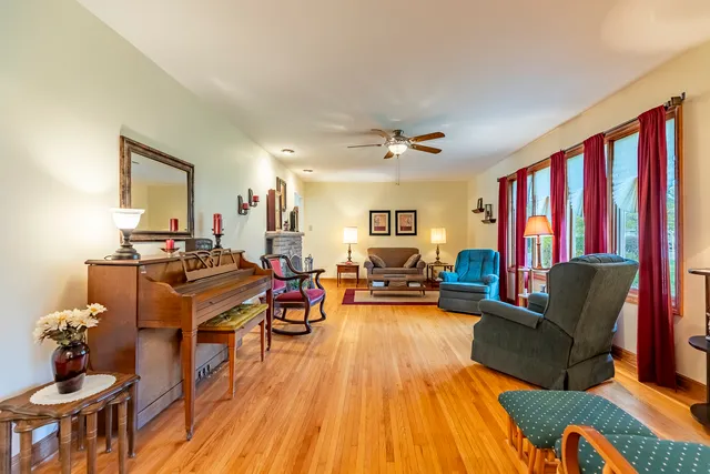 a large kitchen with stainless steel appliances granite countertop a stove a sink and a dining table view