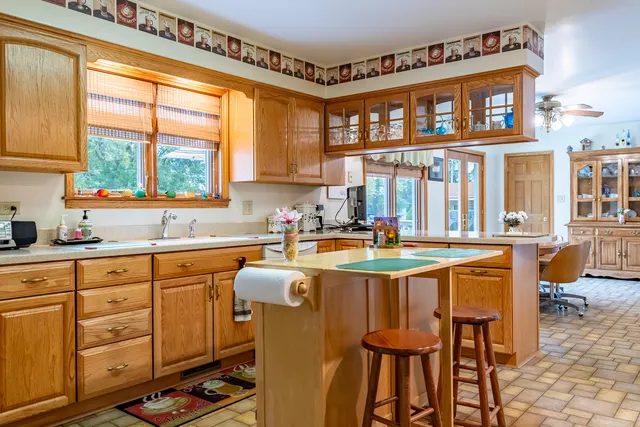 a kitchen with a sink and cabinets