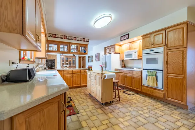 a bedroom with a bed and a book shelf