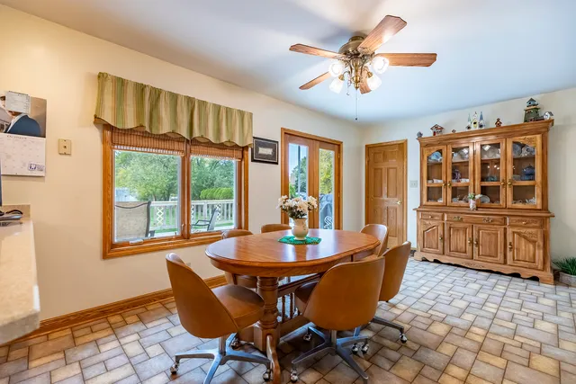 a spacious bathroom with a granite countertop sink a toilet and bathtub