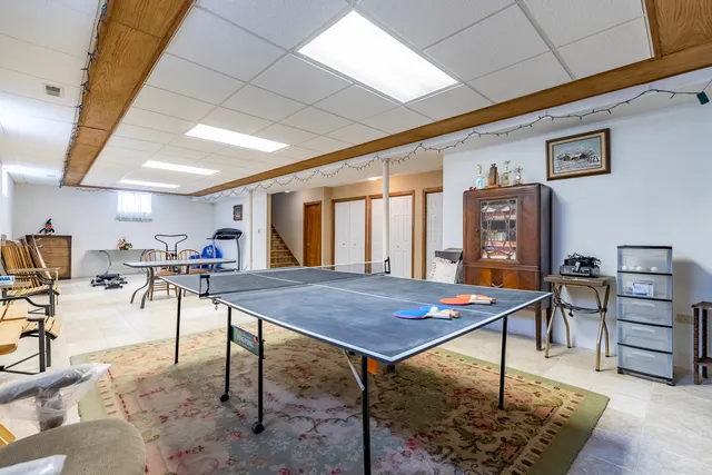 a view of a deck with wooden floor and outdoor seating