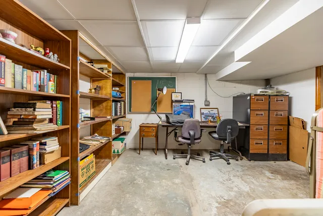 a view of house with a yard and deck