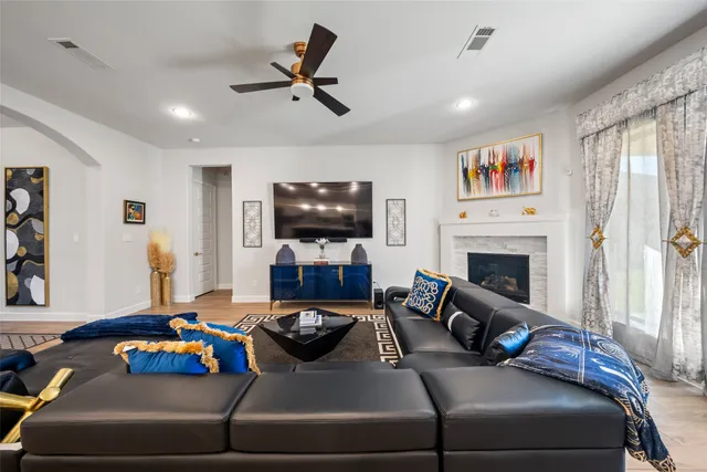 a living room with furniture and a flat screen tv