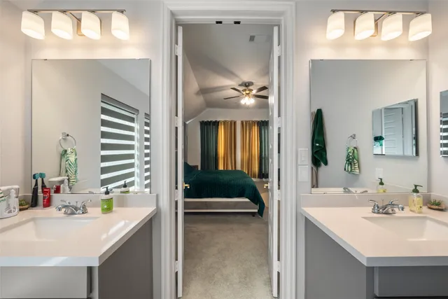a en suite bathroom with a sink and mirror