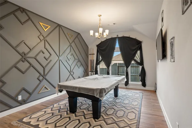 a view of a livingroom with furniture and wooden floor