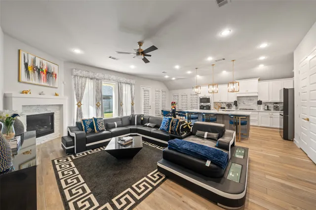 a living room with furniture and a fireplace