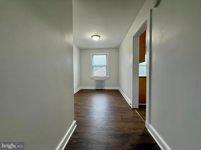 a view of gallery with wooden floor