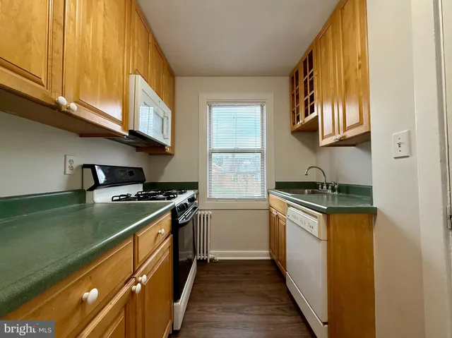 a kitchen with a stove and a sink