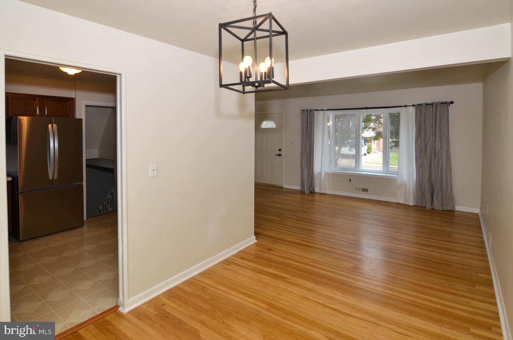 108 Winding Way Hamilton, NJ 08620 - Photo 11 of 29 wooden floor in an empty room with a window