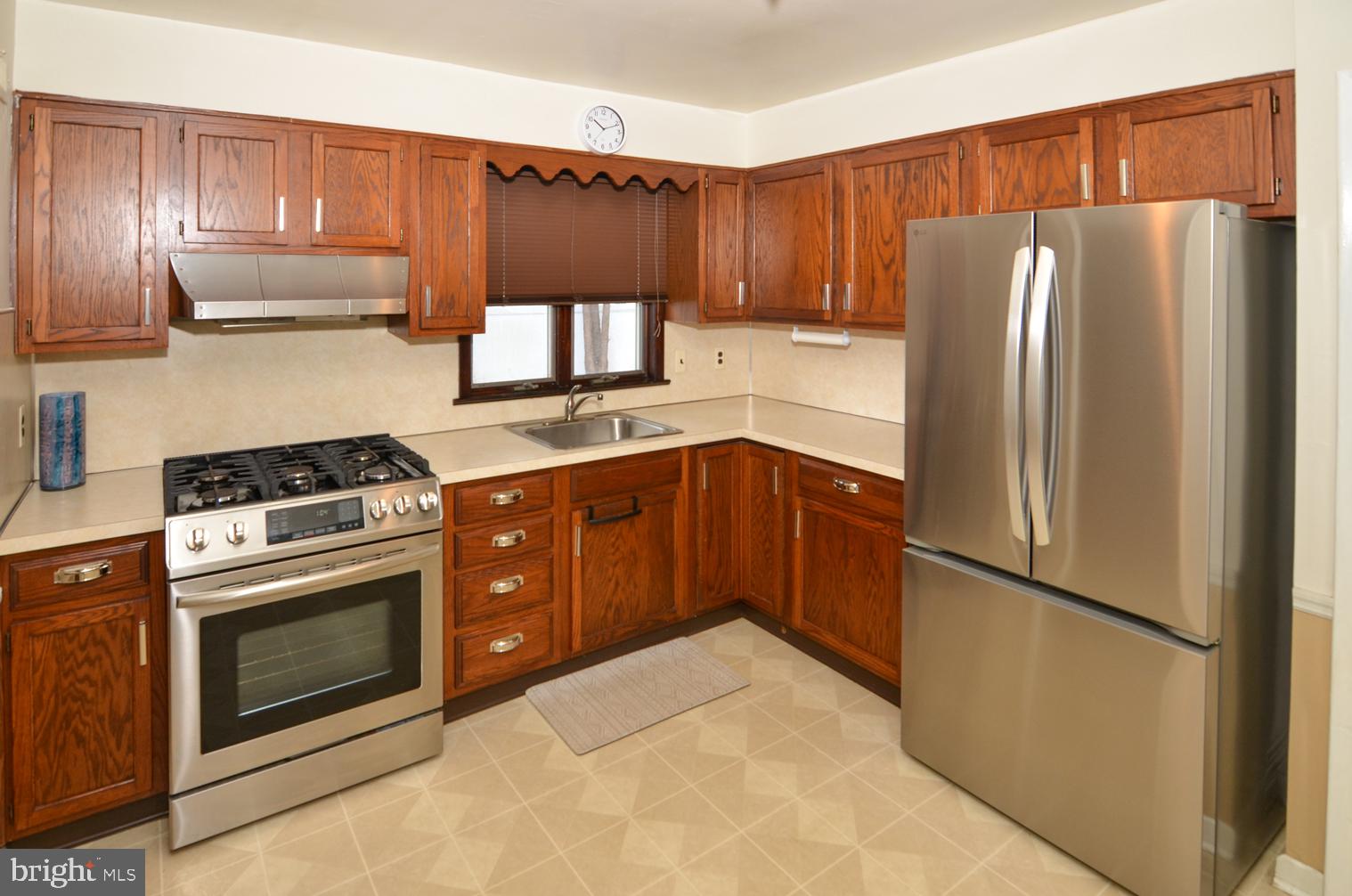108 Winding Way Hamilton, NJ 08620 - Photo 12 of 29 a kitchen with a refrigerator sink and cabinets