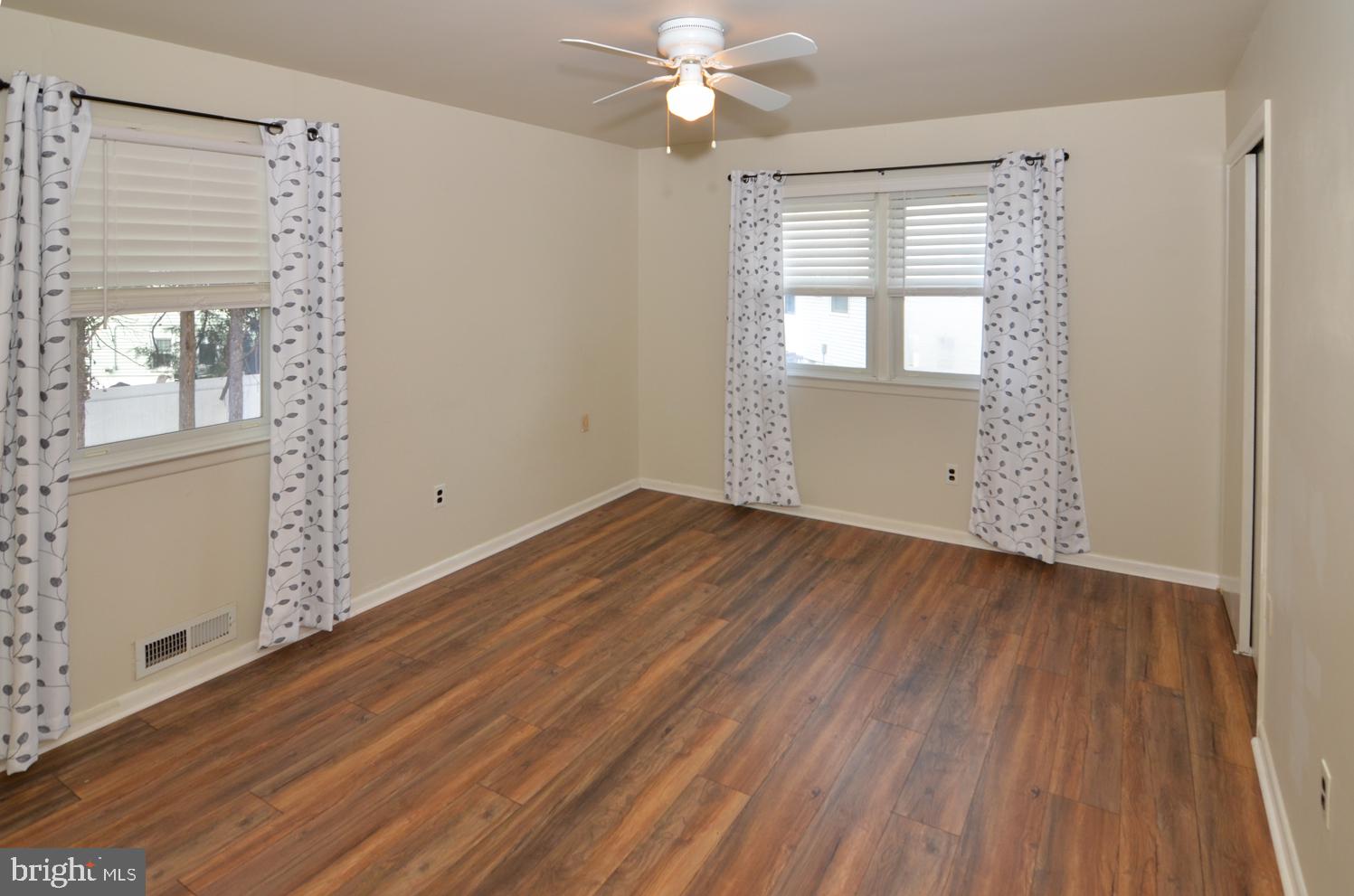 108 Winding Way Hamilton, NJ 08620 - Photo 17 of 29 wooden floor in an empty room with a window