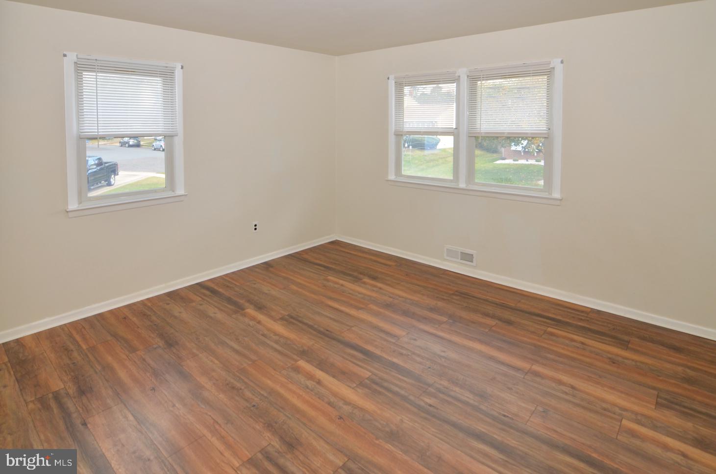 108 Winding Way Hamilton, NJ 08620 - Photo 19 of 29 an empty room with wooden floor and windows