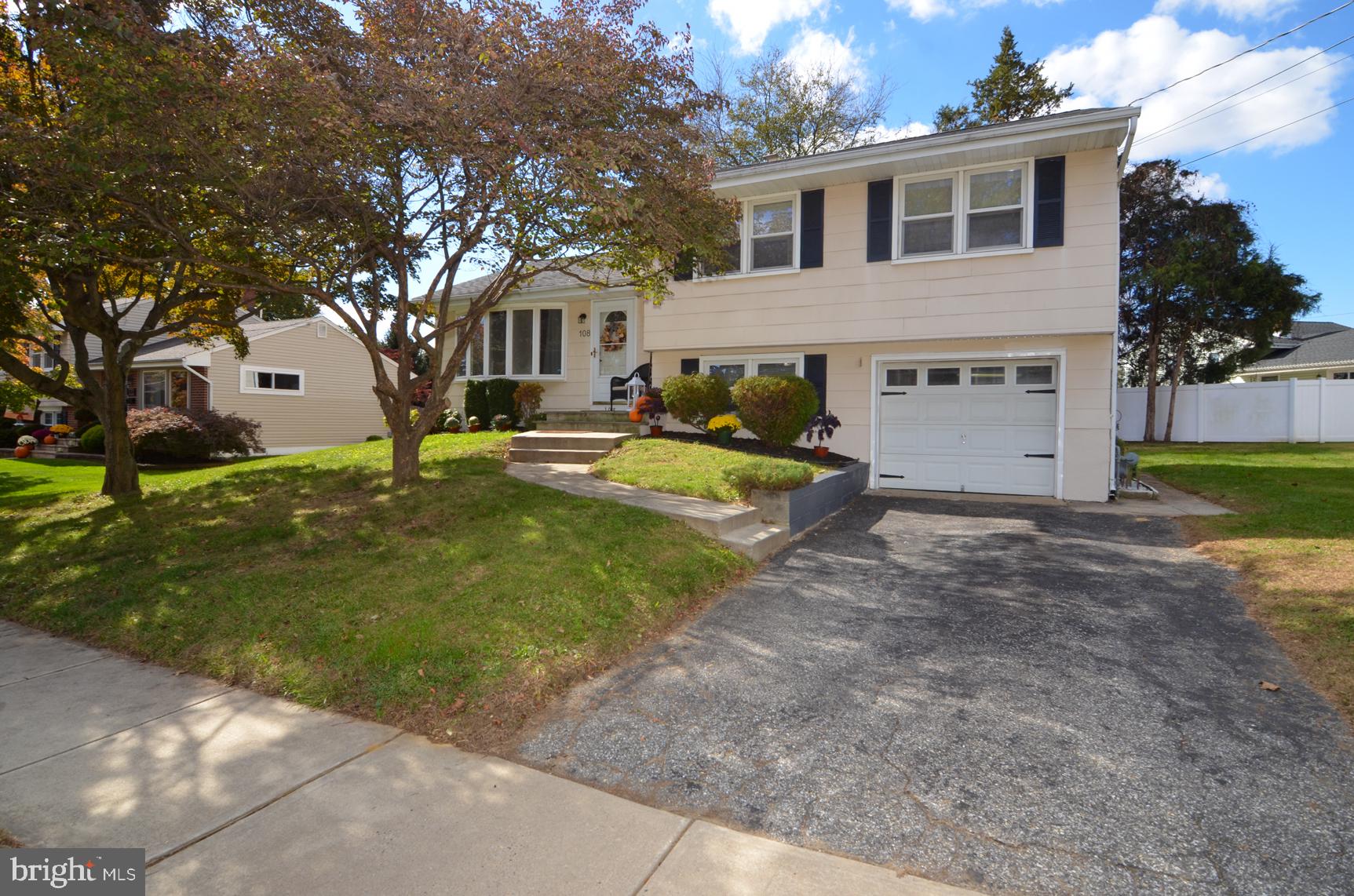 108 Winding Way Hamilton, NJ 08620 - Photo 2 of 29 a view of a house with backyard and a tree