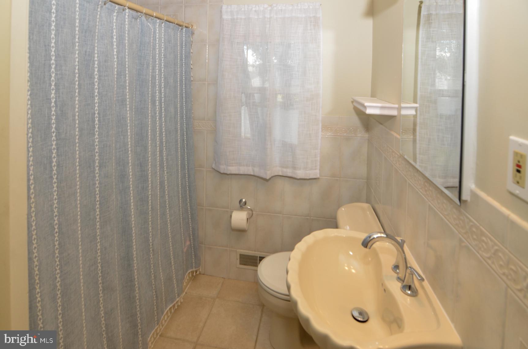 108 Winding Way Hamilton, NJ 08620 - Photo 22 of 29 a bathroom with a sink and mirror