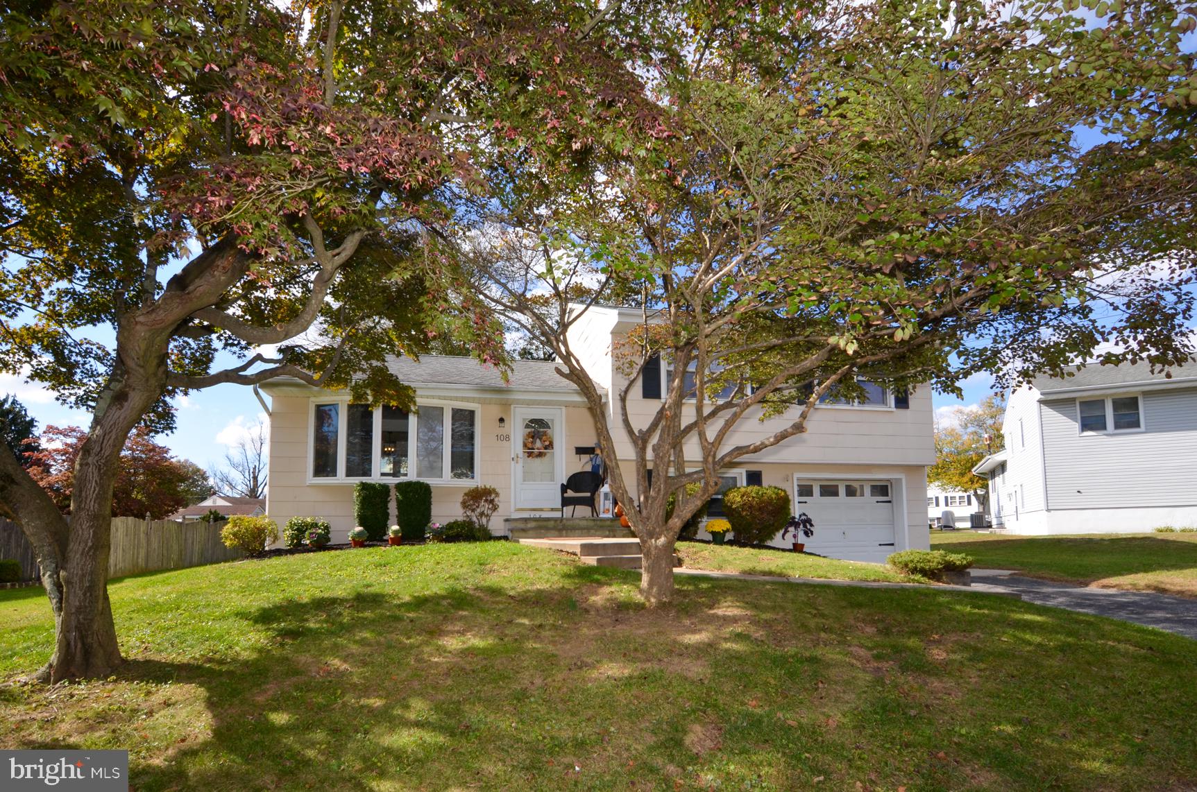 108 Winding Way Hamilton, NJ 08620 - Photo 27 of 29 a front view of a house with a yard and trees