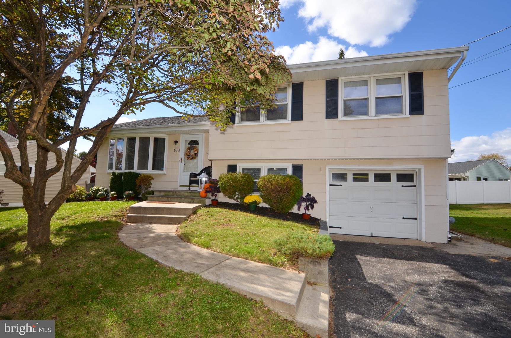 108 Winding Way Hamilton, NJ 08620 - Photo 29 of 29 a front view of house with yard and trees in the background