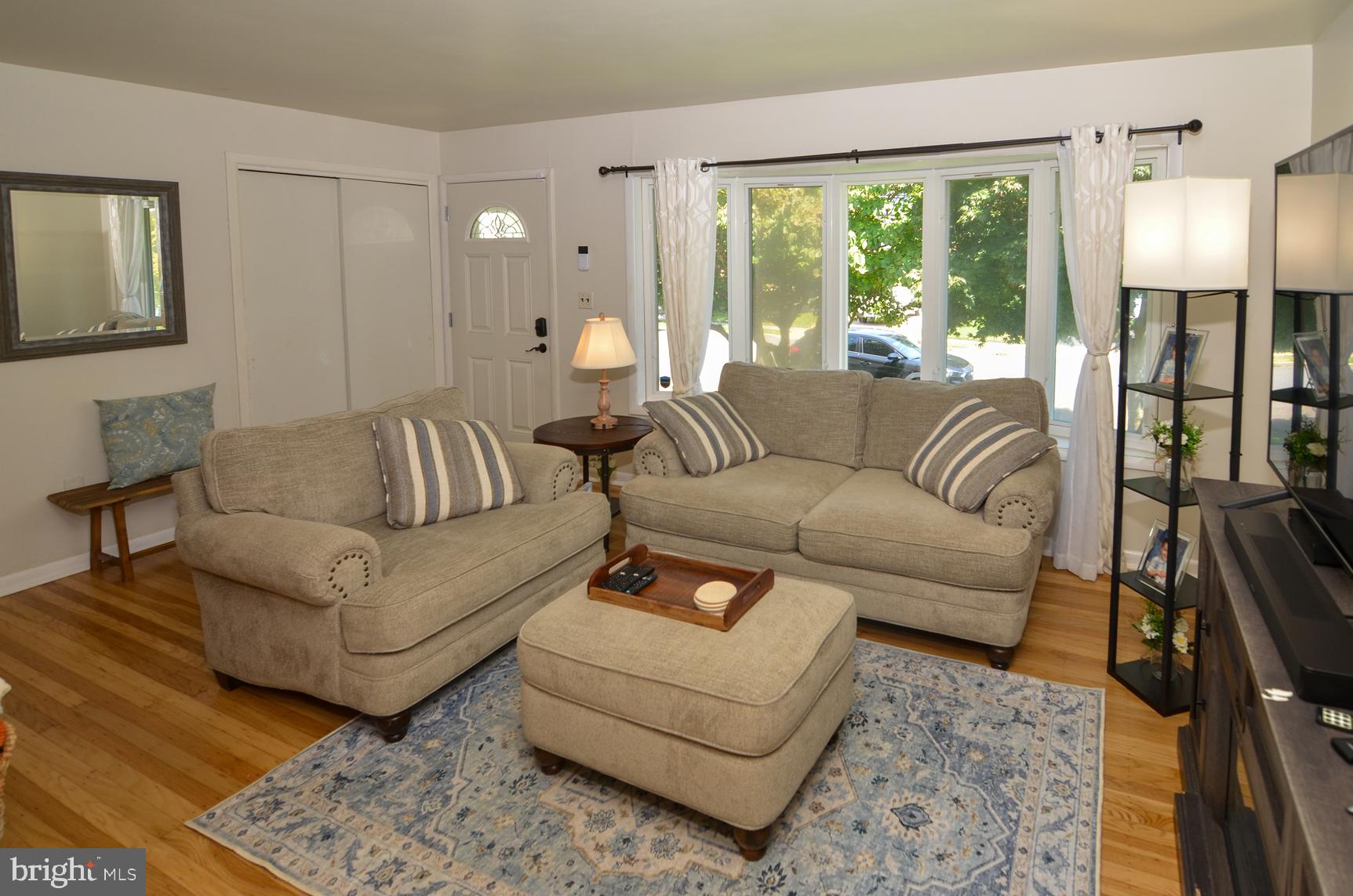 108 Winding Way Hamilton, NJ 08620 - Photo 7 of 29 a living room with furniture and a large window