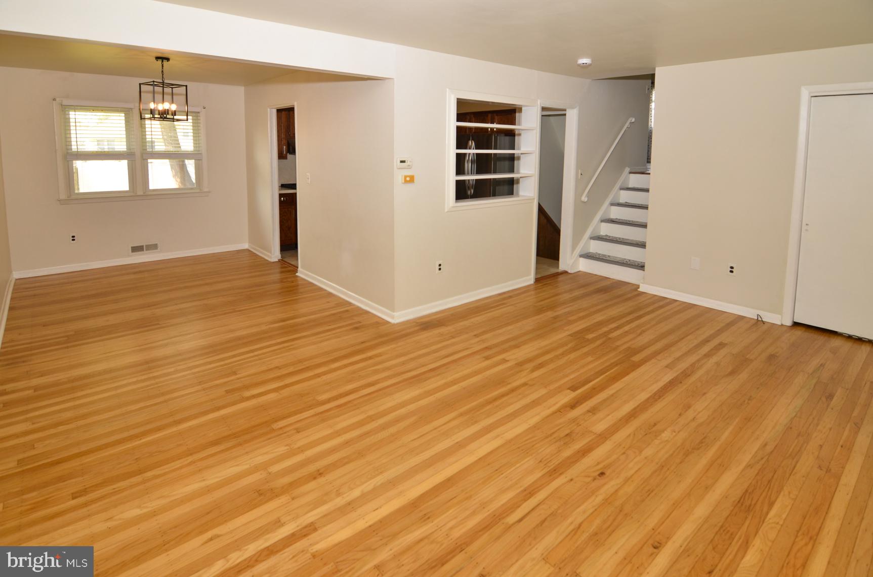 108 Winding Way Hamilton, NJ 08620 - Photo 8 of 29 wooden floor in an empty room with a window