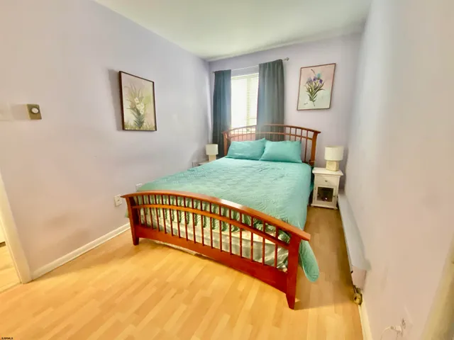 a bathroom with a toilet and a shower curtain