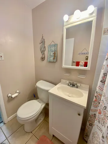 a view of porch with a bench and floor to ceiling window