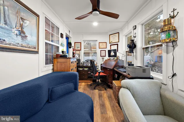 a bedroom with a bed mirror and a window