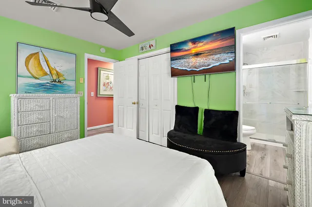 a bathroom with a sink mirror toilet and shower