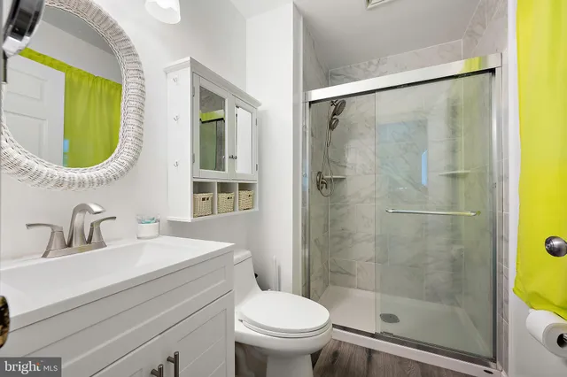 a bedroom with furniture and wooden floor