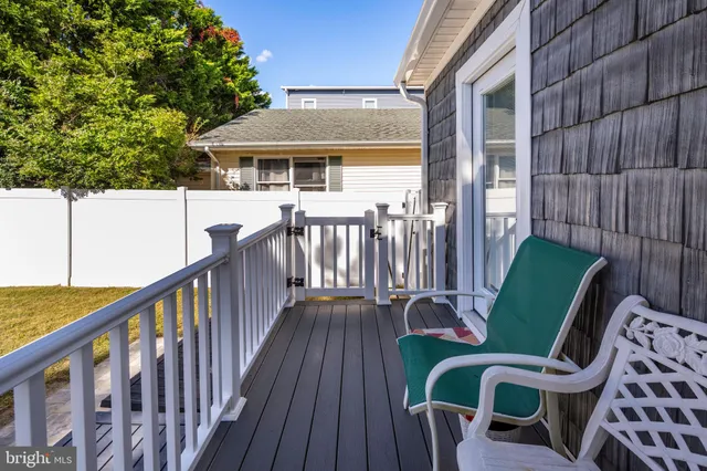 a view of a balcony with furniture