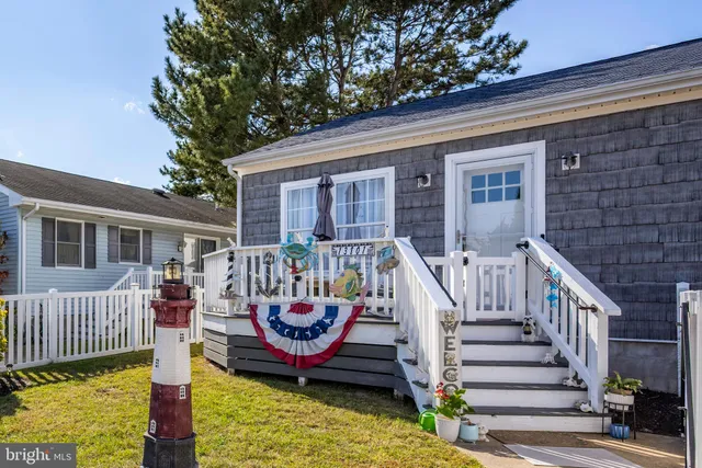 a roof deck with table and chairs and wooden floor
