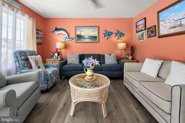 a living room with furniture and a lamp