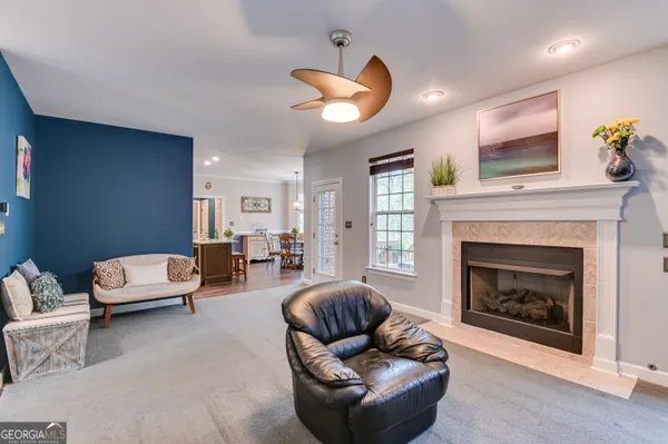 a living room with furniture and a fireplace