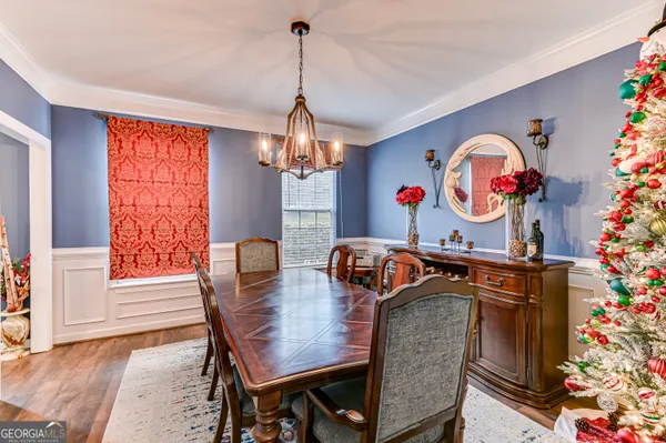 a view of a dining room with furniture window and wooden floor