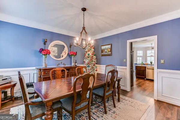 a view of a dining room and a table and chairs