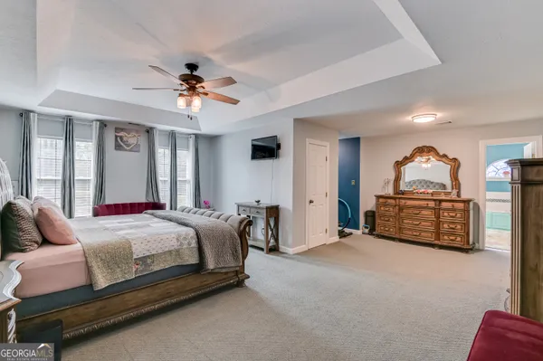a bedroom with bed and window