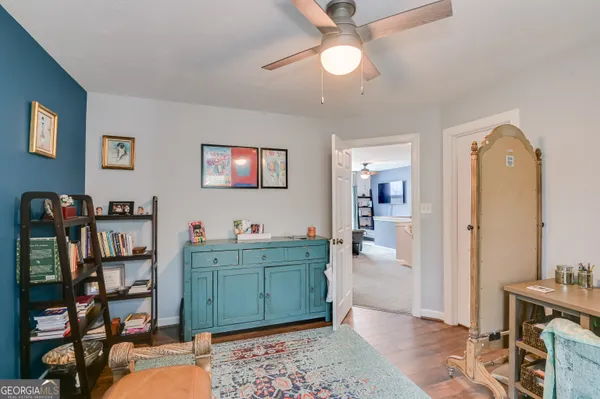 a view of a workspace with furniture and cabinet