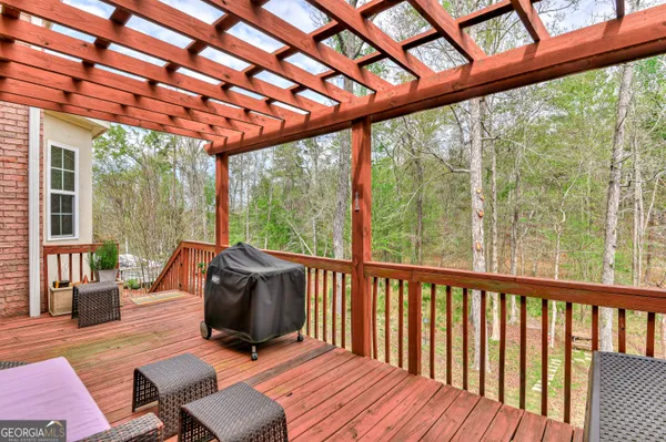 a balcony with furniture and wooden floor